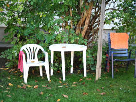 Two chairs in a courtyard